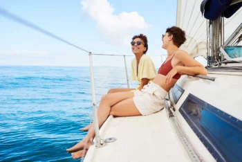 group of friends having fun in boat experiences during the weekend